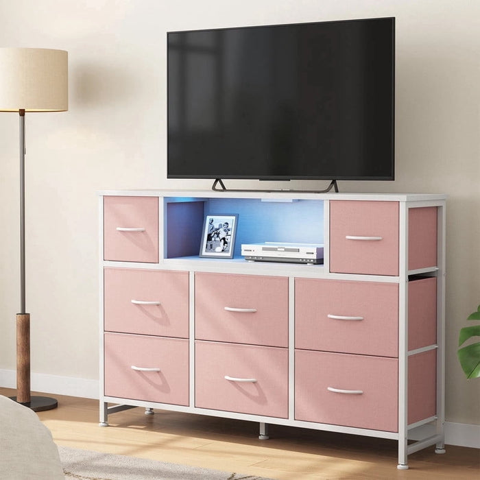 Nextay LED TV Stand with Charging Station, Music-Sync Light Up Entertainment Center, 8 Fabric Drawer Dresser for Bedroom & Living Room, Pink(Fits 45-55 inch TV)